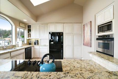 The kitchen has granite countertops, top-of-the-line appliances and everything you need to cook a gourmet meal.