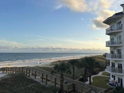 Looking over the new boardwalk to the beach from the balcony of the unit.