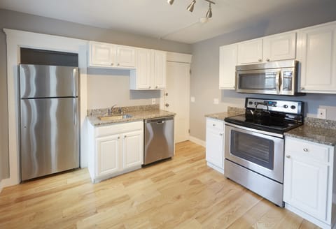 Kitchen with new floors and appliances.  Harbor views out of windows