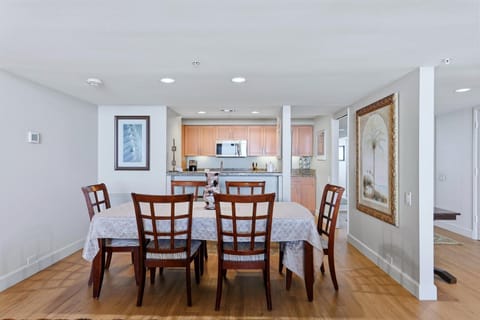 Gather around this elegant dining table for memorable meals with your travel companions in this open-concept space.