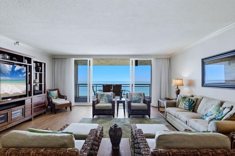 Sink into plush seating while tropical ocean views fill your windows, creating your perfect seaside sanctuary.