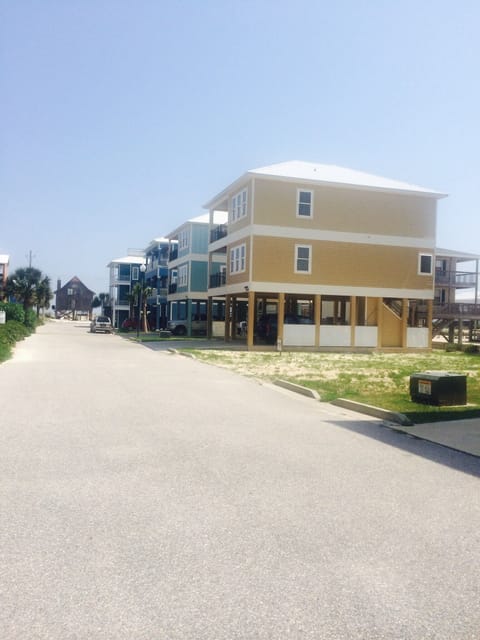 House from the outside, walking back from pool. 