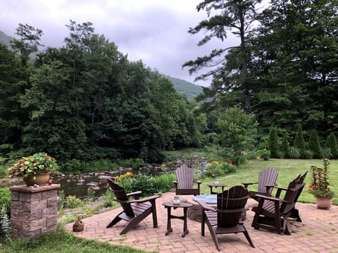 Stream side patio with fire pit