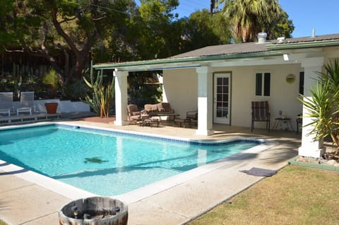 View to the rear of the house and separate entrance to Master Bedroom.
