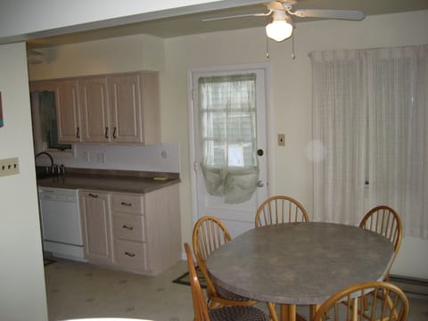 Eating area with kitchen in background