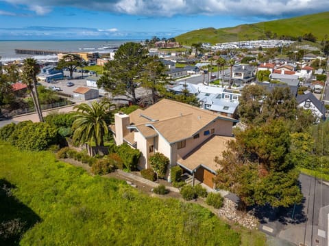 Creekside Charm The backyard and balconies full of afternoon sun.