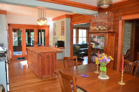 Dining room & kitchen looking through to family room and screened porch