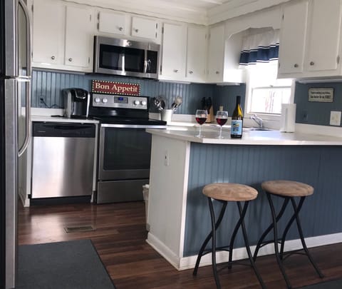 Up to date, fully stocked kitchen.