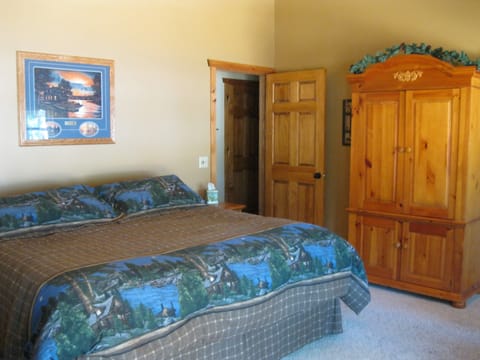 Master bedroom with lake view and king size bed