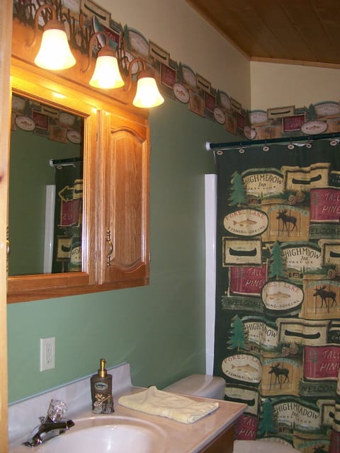 Full size bath with tub & shower spout attached to master bedroom