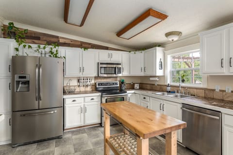 Light and bright, fully stocked kitchen for all your cooking needs.