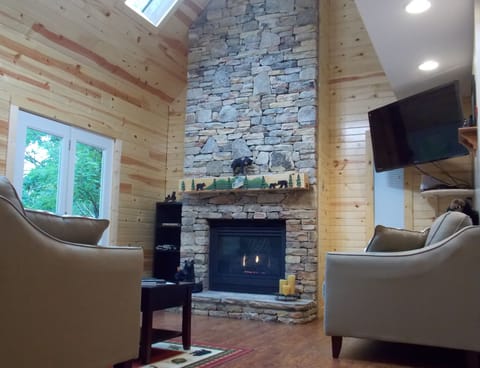 Living Room with stacked stone fireplace.