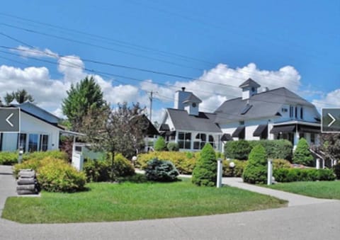 White Fence Main House and Carriage House on the left.