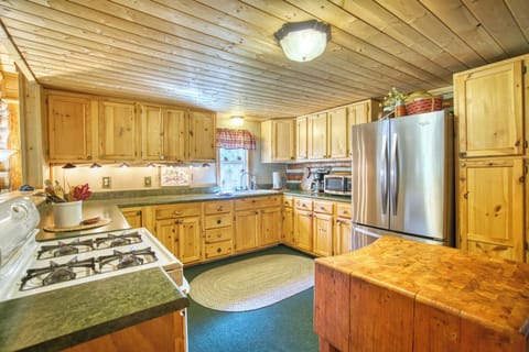 Spacious kitchen - gas range - stocked with pots, pans, utensils, service wares