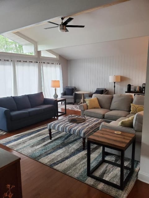 Family room.  L-shaped couch and a pull out Queen sofa bed in another couch.  