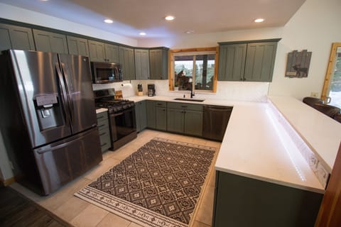 Brand new remodeled kitchen!  Custom floor and backsplash tile, quartz counters.