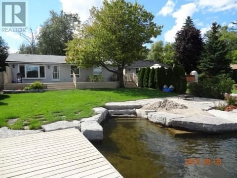 Waterfront beautiful stone walk-in, built in sand area. great for children 