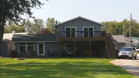 View from the lake side looking back at our home, deck and outdoor living area.
