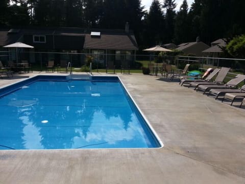 Outdoor pool with change rooms, washrooms and outdoor hot tub. 