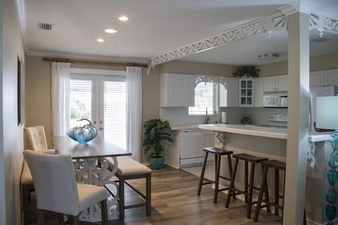 dining area opening on to outside, under cover deck