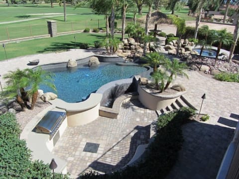 Your own heated pool, water features, heated spa and tiki bar on golf course.