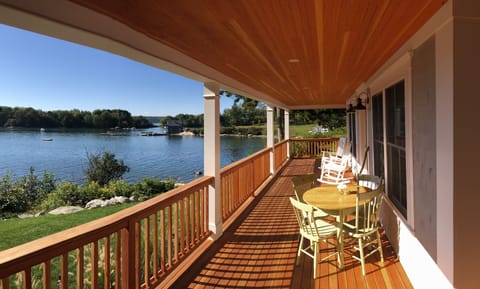 Spectacular wrap around porch with commanding view of the Cove/Ocean