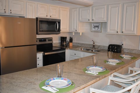 Enjoy granite countertops, tile backsplash and stainless appliances!