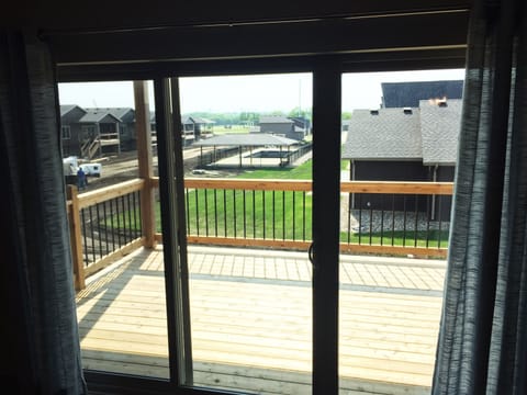 Morning coffee on the covered patio. Now with table, chairs, and gas grill. 