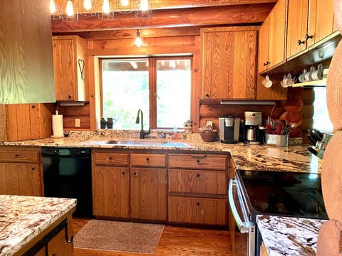 Kitchen, sink window overlooking backyard and sometimes Mt. Rainier view