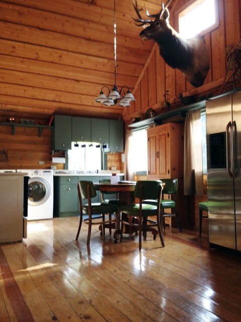 Roomy kitchen with refinished pine floor and newer appliances. Table seats 6.