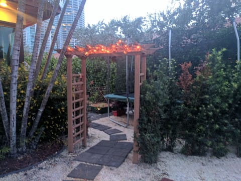 Right side entrance by garden and Trampoline 