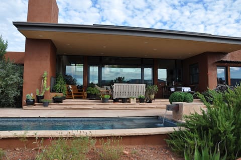 Covered patio/seating, fireplace, outdoor dining from pool