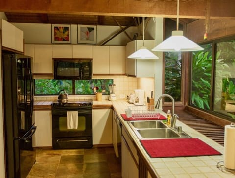 Kitchen and bay window looking over grounds & mountains