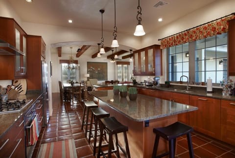 Modern, gourmet kitchen with loads of workspace is a chef's dream.