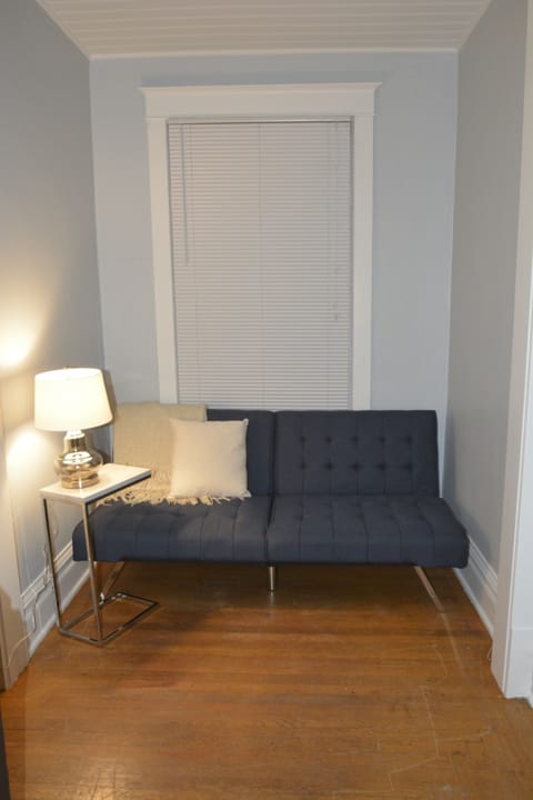 Futon nook off living room transitions into double size sleeping space
