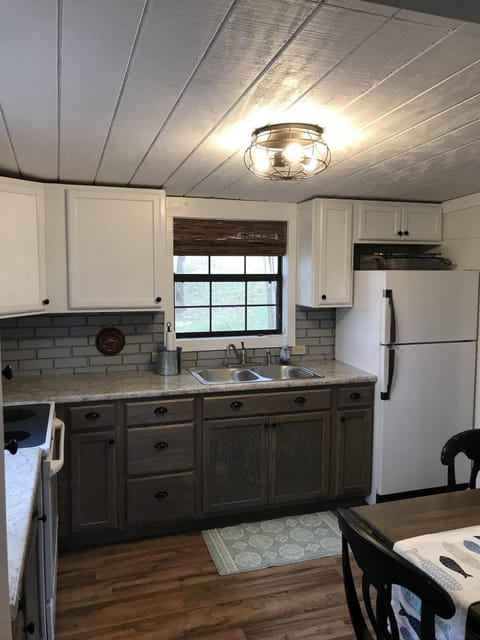 Kitchen is well stocked with dishes, utensils and most cooking necessities.
