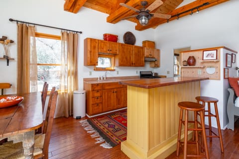 View of kitchen from living/dining areas. Ample room for food prep. 