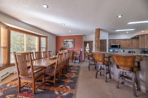 House seats 22 for meals--12 at main table, 6 at eating bar, and 4 at game table