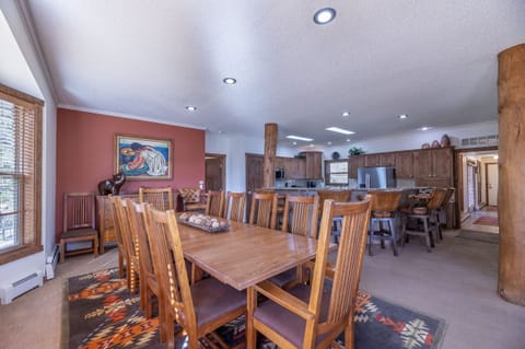 House seats 22 for meals--12 at main table, 6 at eating bar, and 4 at game table