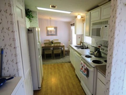 Galley kitchen leads out to the lanai