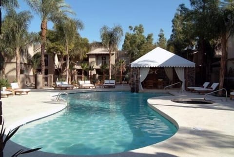 Inviting pool and hot tub steps away from the condo unit