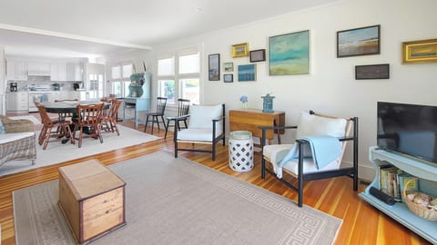 Comfortable family room with flat screen TV and Cape Cod Bay views