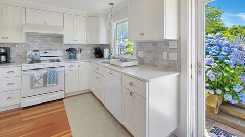 Fully renovated kitchen with quartz counter tops