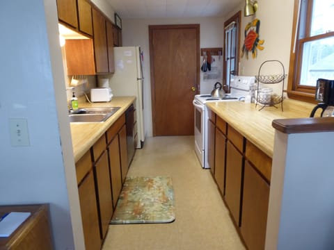 Kitchen (from dining area looking towards door to pantry/laundry room)