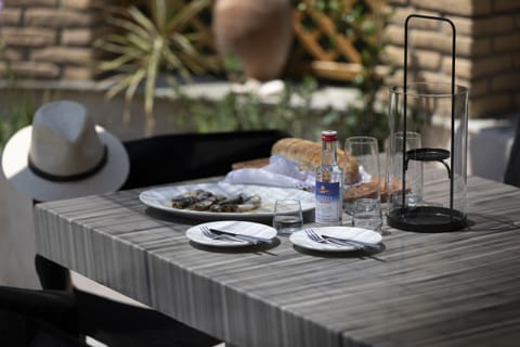 Greek ouzo with typicall greek meze at the courtyard