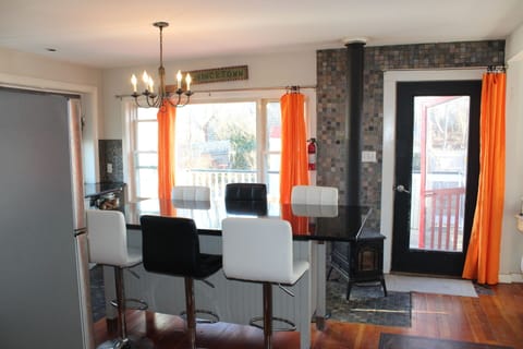 kitchen island with door to the deck and the backyard 