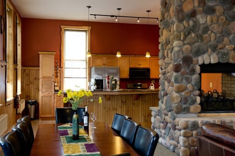 Fireplace and kitchen open up to the dining area and great room.