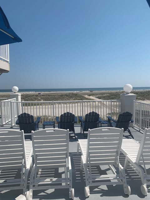 Ocean front sundeck with new loungers and adirondack chairs just steps outside
