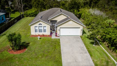 Aerial Overview of home amid lush natural protected wetlands