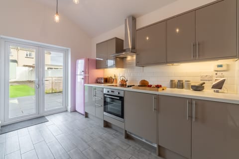 Miss Fishers, Port Isaac. Ground floor: Modern kitchen with french doors to garden